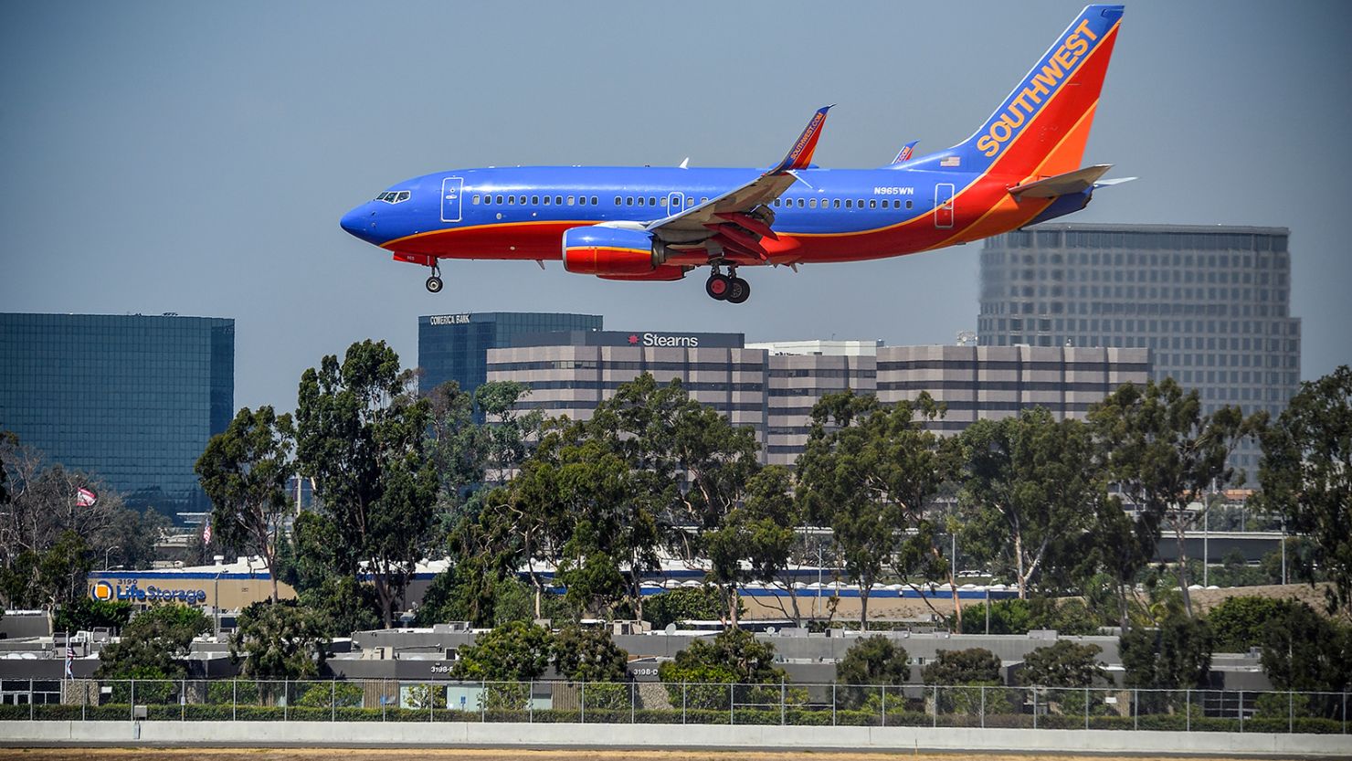 SANTA ANA, CA - SEPTEMBER 06: A Southwest jet lands on runway 20R at John Wayne Airport in Santa Ana, California, on Wednesday, September 6, 2017. 