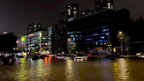 Submerged cars on a road in Seoul, South Korea, during heavy rain and flooding on August 8, 2022.