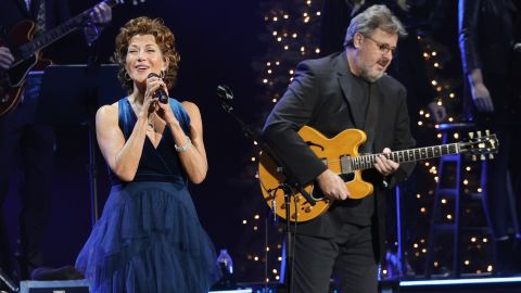 (From left) Amy Grant and Vince Gill perform at the Ryman Auditorium on December 13, 2021, in Nashville, Tennessee.