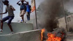Haitians protesting high prices and shortages burn tires on a street of Port-au-Prince on July 13, 2022. - Soaring prices, food and fuel shortages and rampant gang violence are accelerating a brutal downward spiral in the security situation in the Haitian capital Port au Prince, and threatening the humanitarian aid the increasingly desperate population relies on. (Photo by Richard Pierrin / AFP) (Photo by RICHARD PIERRIN/AFP via Getty Images)