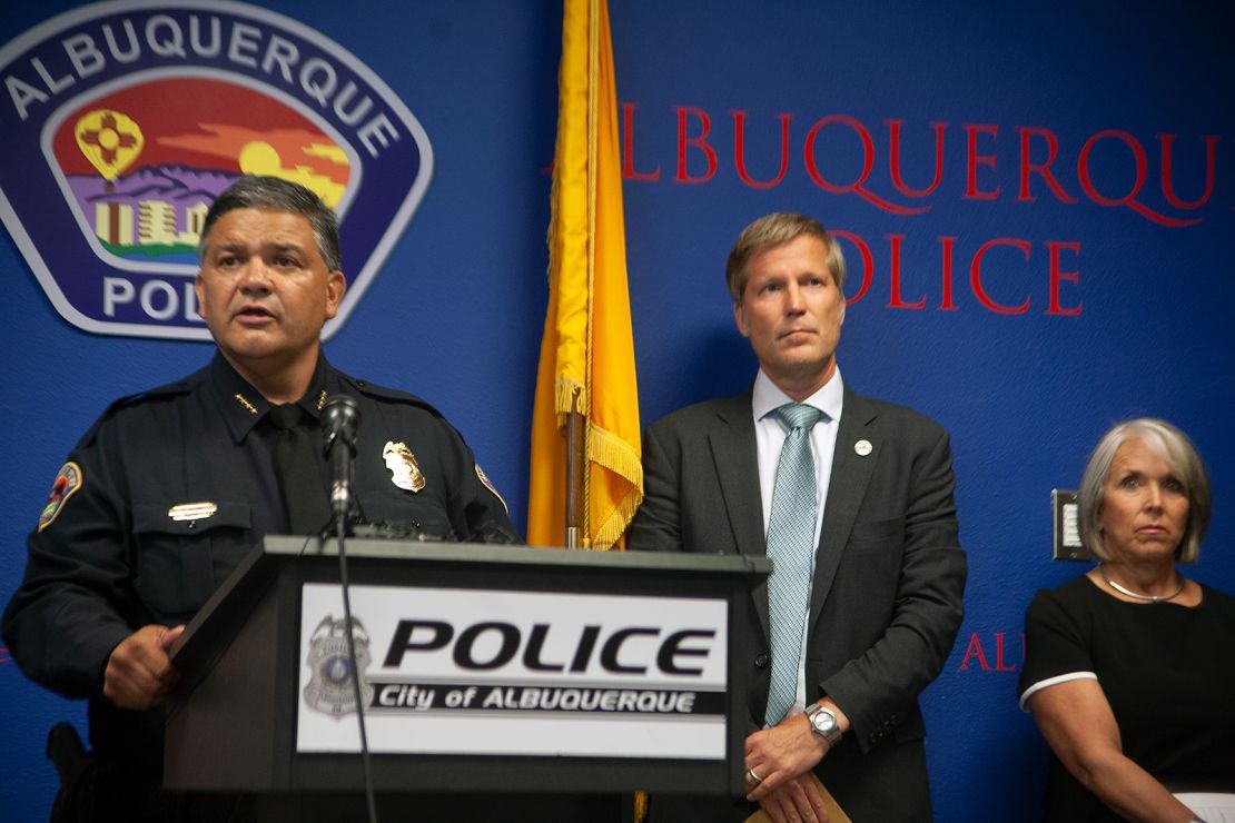 Albuquerque Police Chief Harold Medina (left) is joined Tuesday by Mayor Tim Keller and Gov. Michelle Lujan Grisham in announcing the suspect's arrest.