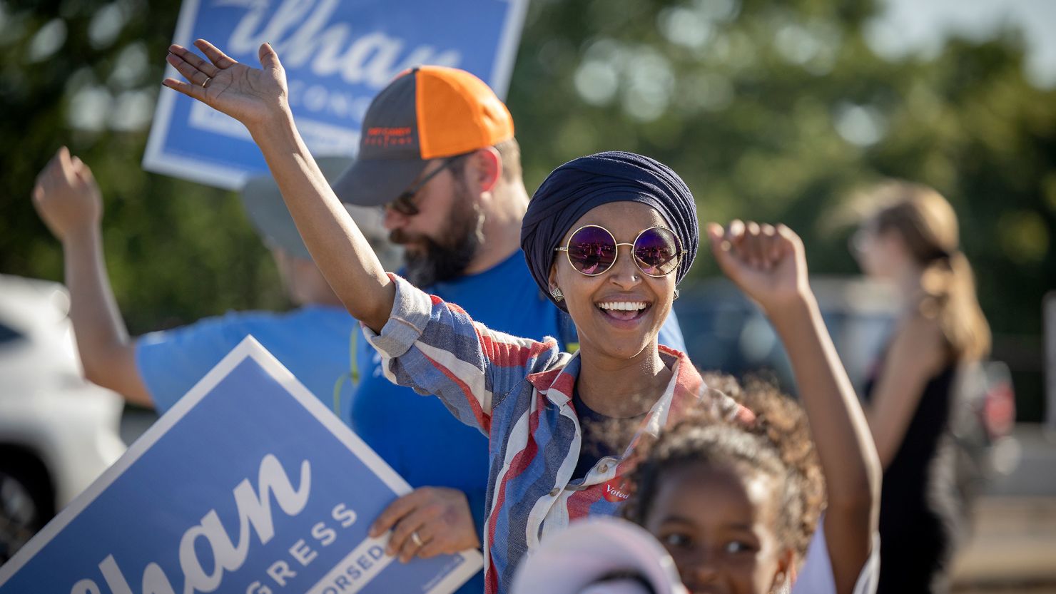US Rep. Ilhan Omar waves to passersby for support during a voter engagement event on the corner of Broadway and Central Avenues in Minneapolis, on August 9, 2022. 