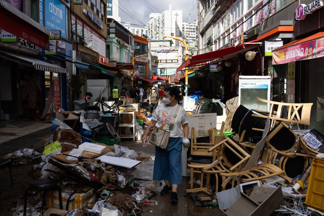 Debris piled up in front of flood-damaged stores at the Namsung Sagye Market in Seoul, South Korea, on August 10.