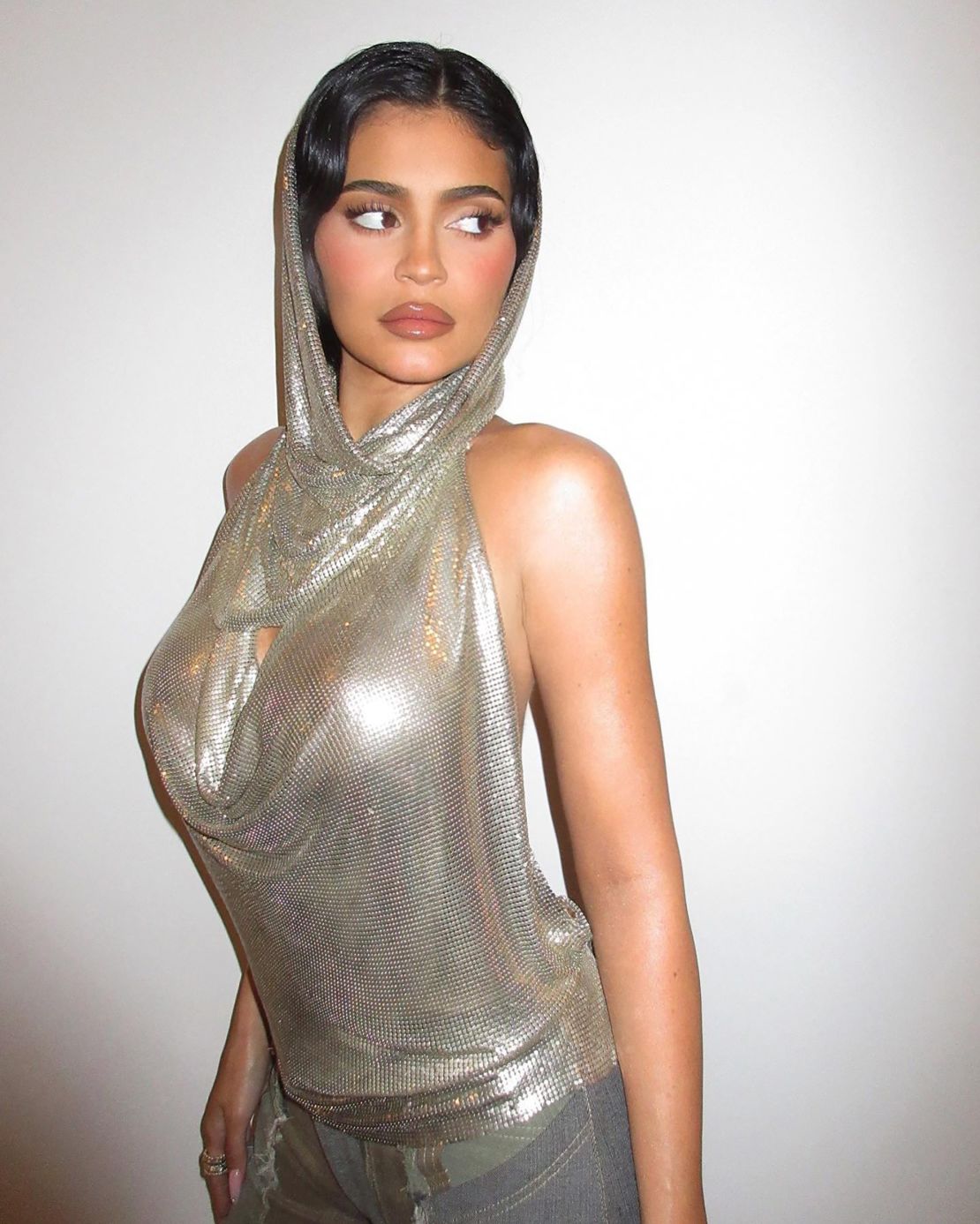 Kylie Jenner posted a photograph of her new outfit to Instagram, wearing a silver chainmail mesh hood.