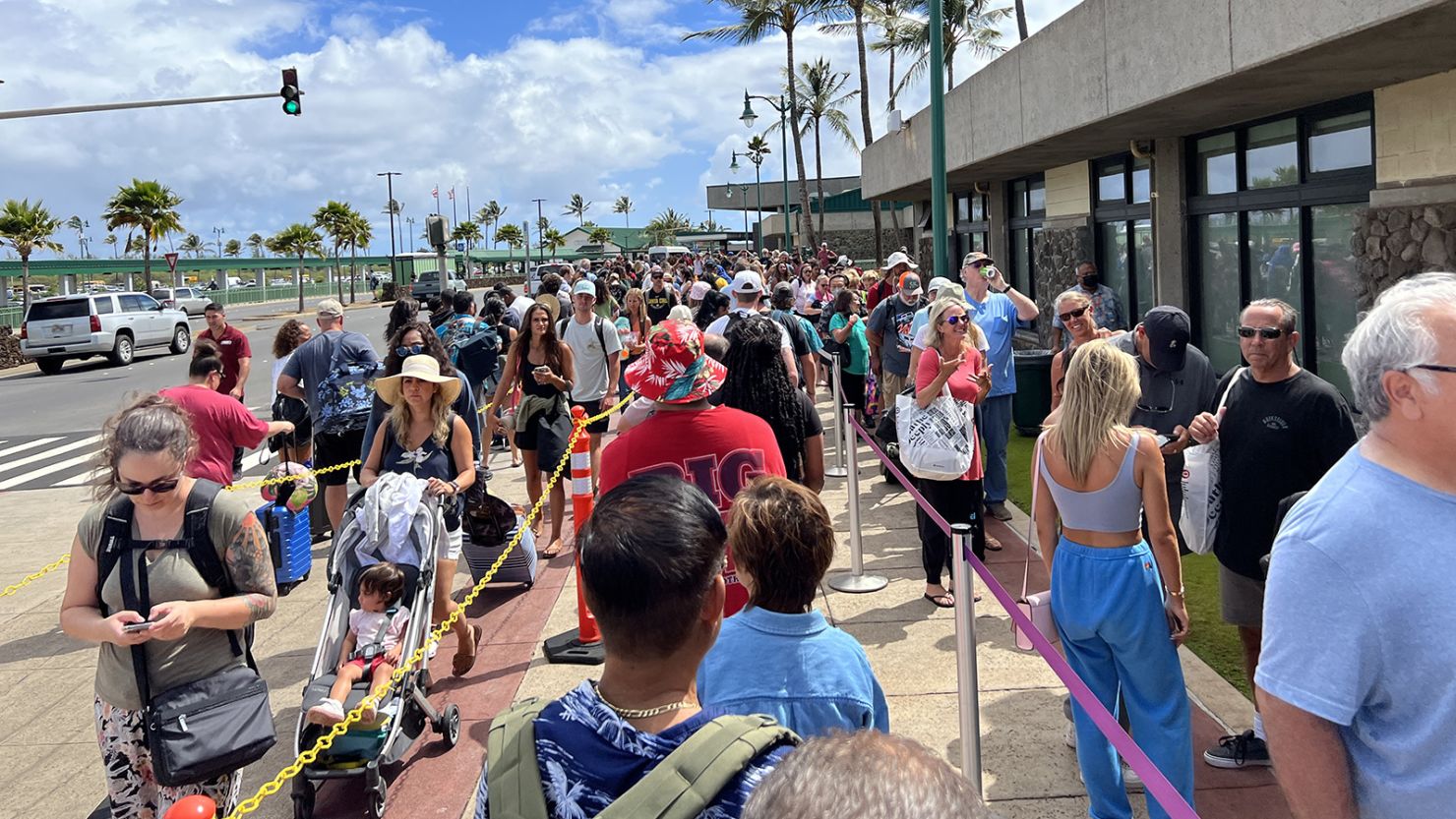 Extremely long security lines extending beyond the terminal building and onto the street outside the Kahului airport in Maui, Kahului, Hawaii, August 1st 2022. 
