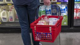 A customer holds a basket while shopping at a grocery store in San Francisco, California, U.S., on Thursday, Nov. 11, 2021. 