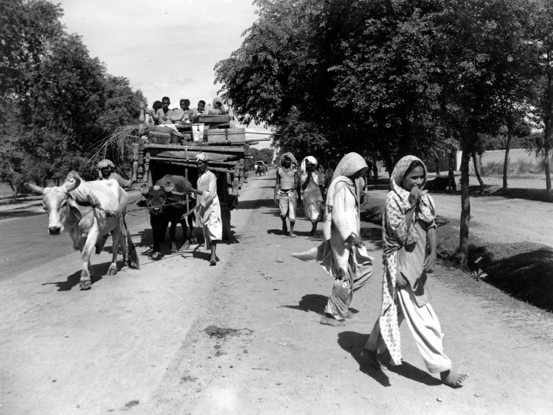 A bullock cart loaded with children and household goods belonging to a Muslim family travels towards Lahore, Pakistan, on August 26, 1947. 