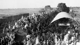 Muslim refugees crowd onto a train bound for Pakistan, as it leaves the New Delhi, India area, Sept, 27, 1947. The refugees cling to wherever they can, on the roof and between the cars. The photo illustrates why casualties are so heavy when these refugee trains are attacked. 