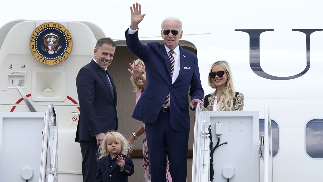 President Joe Biden, center, waves as he is joined by, from left, son Hunter Biden, grandson Beau Biden, first lady Jill Biden, and daughter-in-law Melissa Cohen, as they stand at the top of the steps of Air Force One at Andrews Air Force Base, Md., Wednesday, Aug. 10, 2022. They are heading to South Carolina for a week-long vacation on Kiawah Island. 