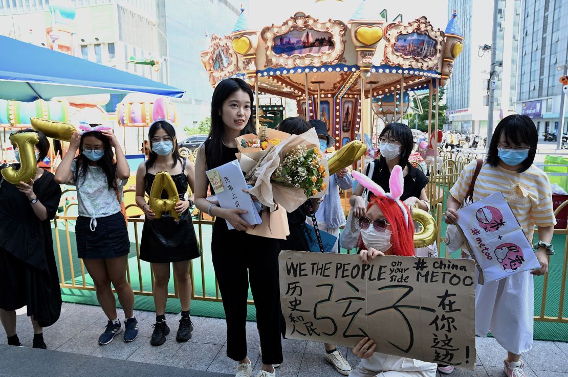 Zhou Xiaoxuan is greeted by a small group of supporters on Wednesday before returning to court for a hearing on her sexual harassment case against television host Zhu Jun.