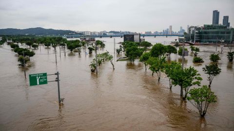 Floodwaters over a parking lot and pedestrian area, which were submerged by the burst banks of the Han River in Seoul on August 10.