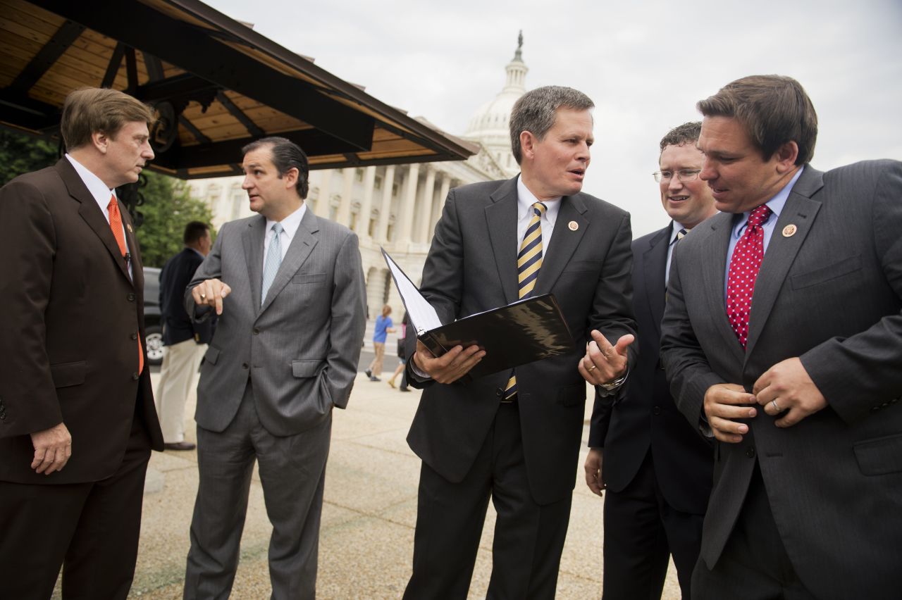 DeSantis, right, prepares for a June 2013 news conference to oppose the Marketplace Fairness Act, also called the internet tax, which would require online retailers to collect a sales tax at the time of a purchase.