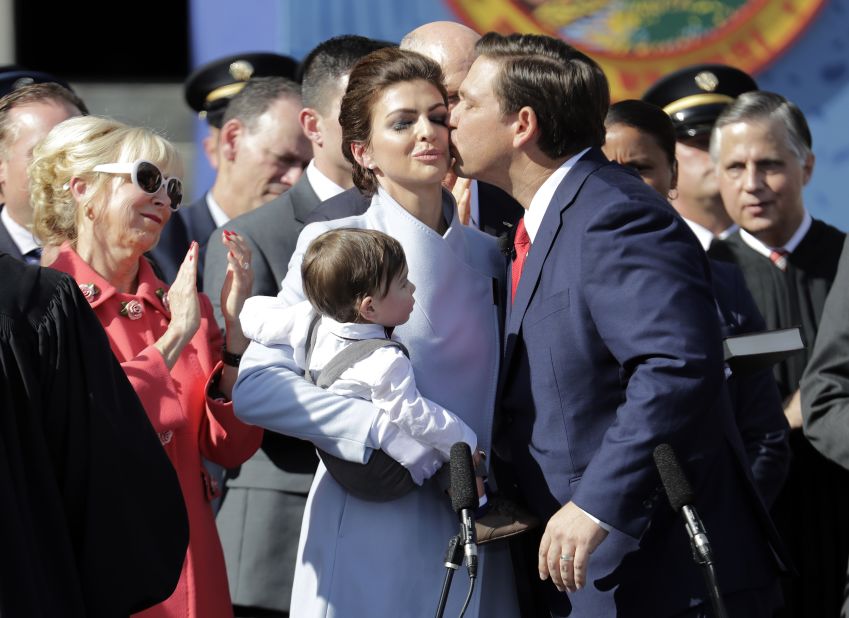 DeSantis kisses his wife after being sworn in as governor in January 2019.