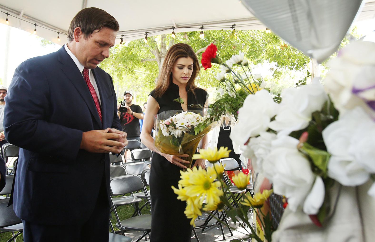 The DeSantises carry flowers to the site of the Pulse nightclub in Orlando in June 2019. It was the three-year anniversary of the deadly shooting there.