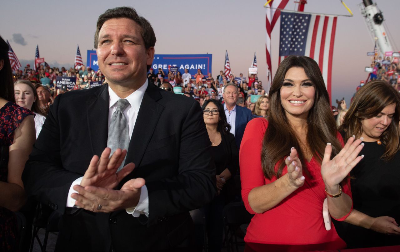 DeSantis and Kimberly Guilfoyle, the finance chairwoman of Trump's campaign, applaud during a Trump rally in Sanford, Florida, in 2020.