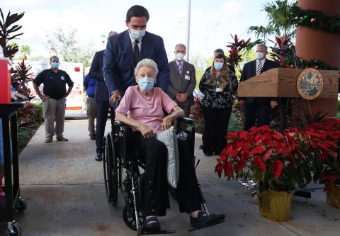 DeSantis pushes Vera Leip, 88, in her wheelchair after she received a Covid-19 vaccine in Pompano Beach, Florida, in 2020. Leip's retirement community was one of the first in the country to receive vaccinations.