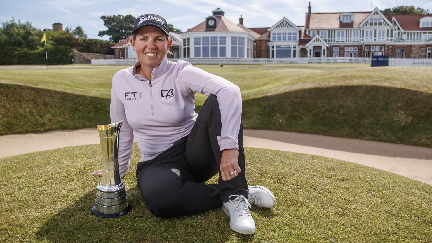 Ashleigh Buhai poses with the Women's Open trophy on the 18th green at Muirfield following her win.