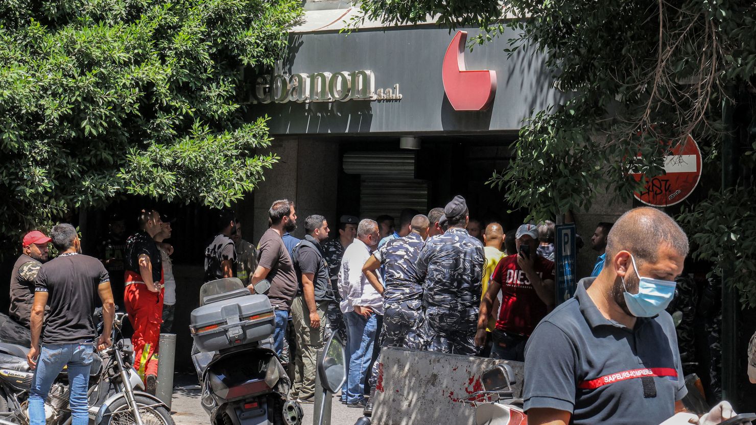 Security forces gather outside a "Federal Bank" branch in Lebanon's capital Beirut on August 11, 2022.