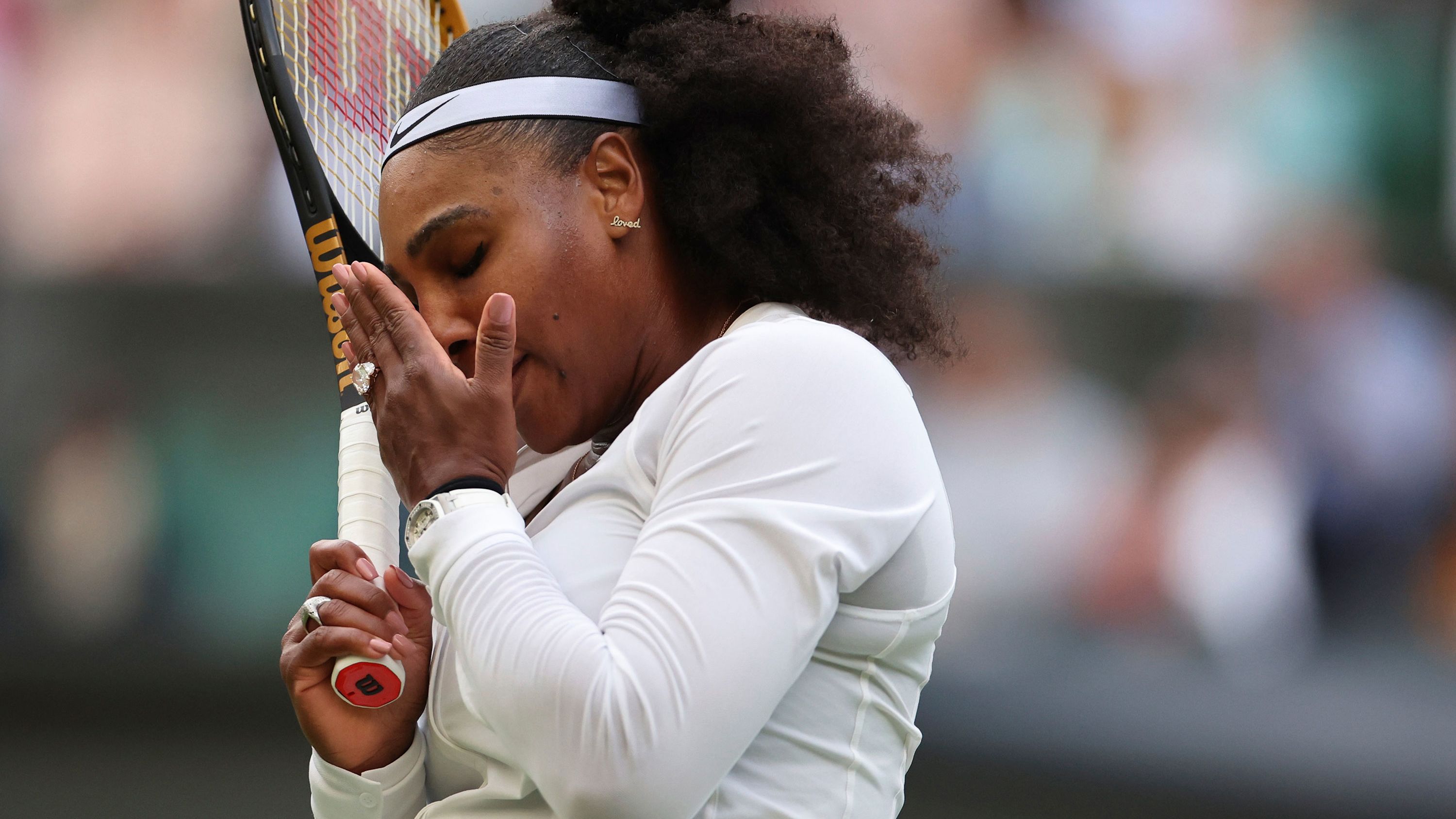 Serena reacts during her first-round Wimbledon loss to Harmony Tan in June.