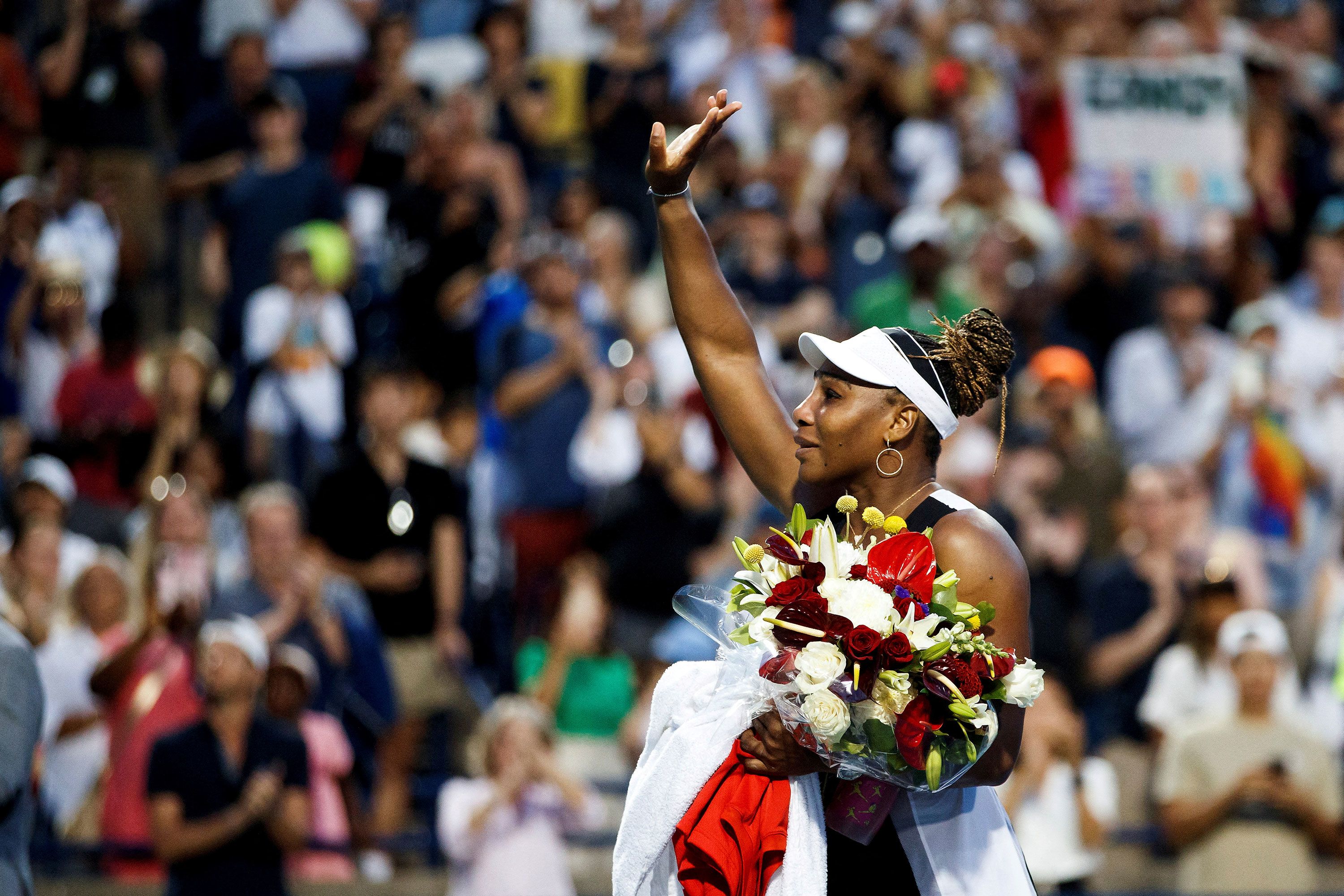 Serena waves to the crowd after losing in the first round of the Canadian Open on August 10. It was her first match since she announced that she would be retiring soon.