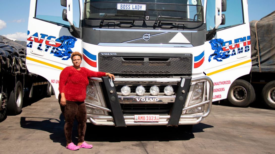 Driver Memory Lambie poses with her truck. "The bridge is 100% perfect to us," she says. 