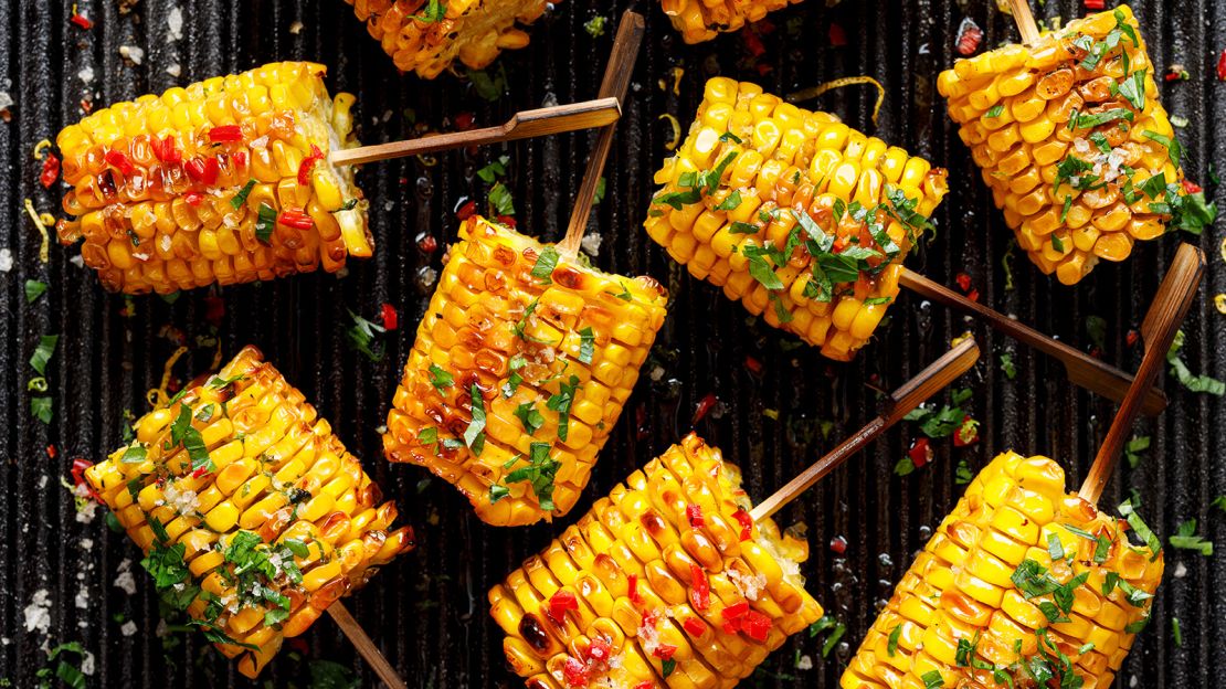 Butter, herbs, salt and aromatic spices help to liven up this luscious grilled corn on the cob.