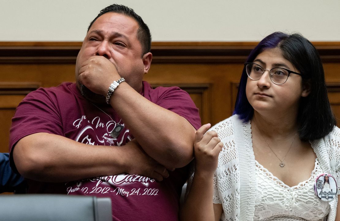 Javier Cazares, left, the father of 9-year-old Jacklyn Cazares, who was killed at Robb Elementary, sits with his daughter Jazmin Cazares during a July 27 House committee hearing in Washington.