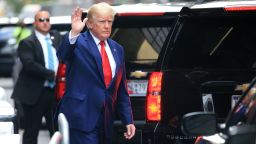 Former US President Donald Trump waves while walking to a vehicle outside of Trump Tower in New York City on August 10, 2022. - Donald Trump on Wednesday declined to answer questions under oath in New York over alleged fraud at his family business, as legal pressures pile up for the former president whose house was raided by the FBI just two days ago. (Photo by STRINGER / AFP) (Photo by STRINGER/AFP via Getty Images)