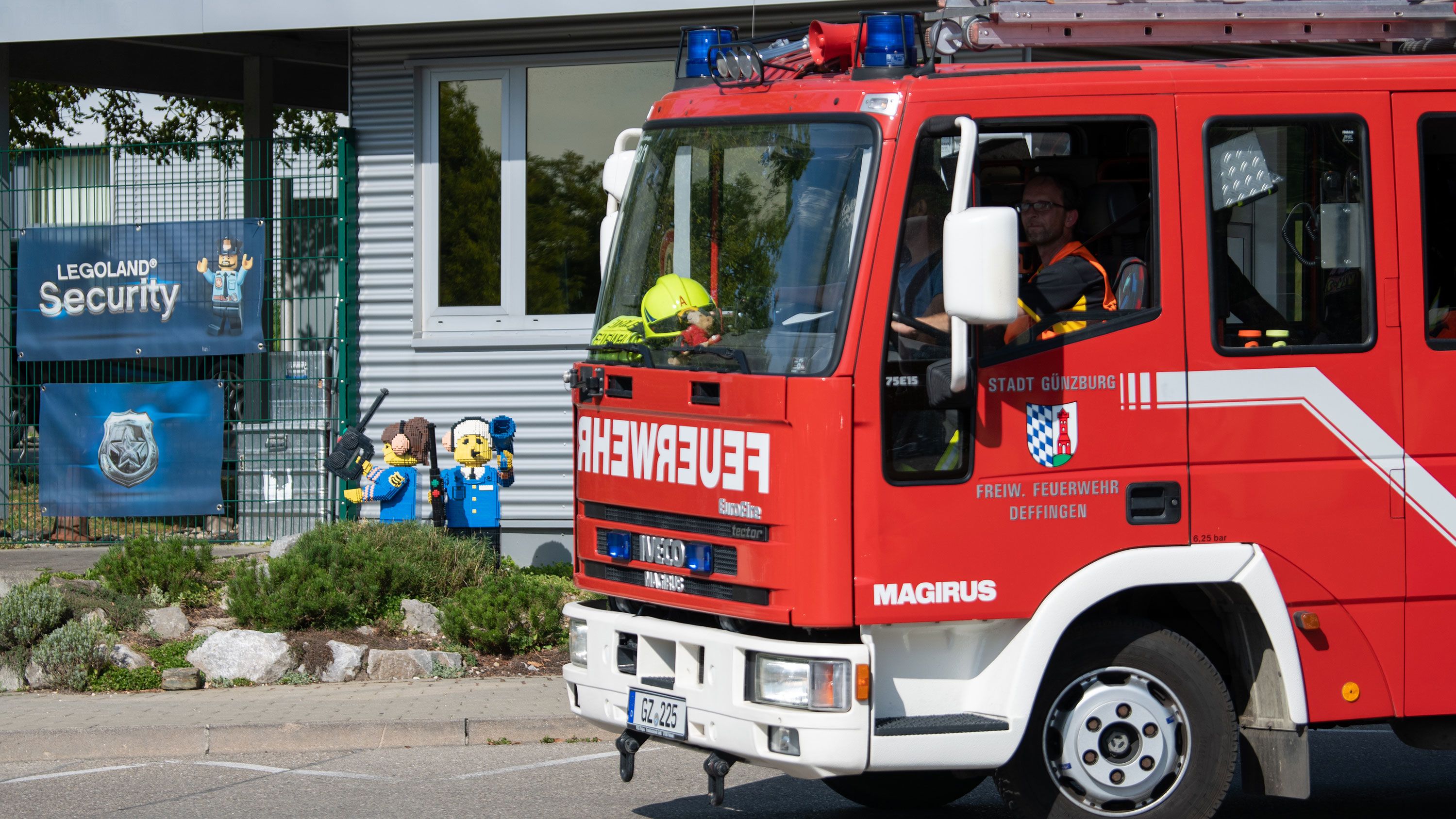 A fire truck drives past the entrance to Legoland in the Bavarian town.
