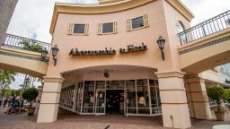 Estero, FL USA - 2-10-2022: Shoppers walk past the facade of Abercrombie & Fitch Clothing Store in Miromar Outlets. an American lifestyle retailer that focuses on casual wear. 