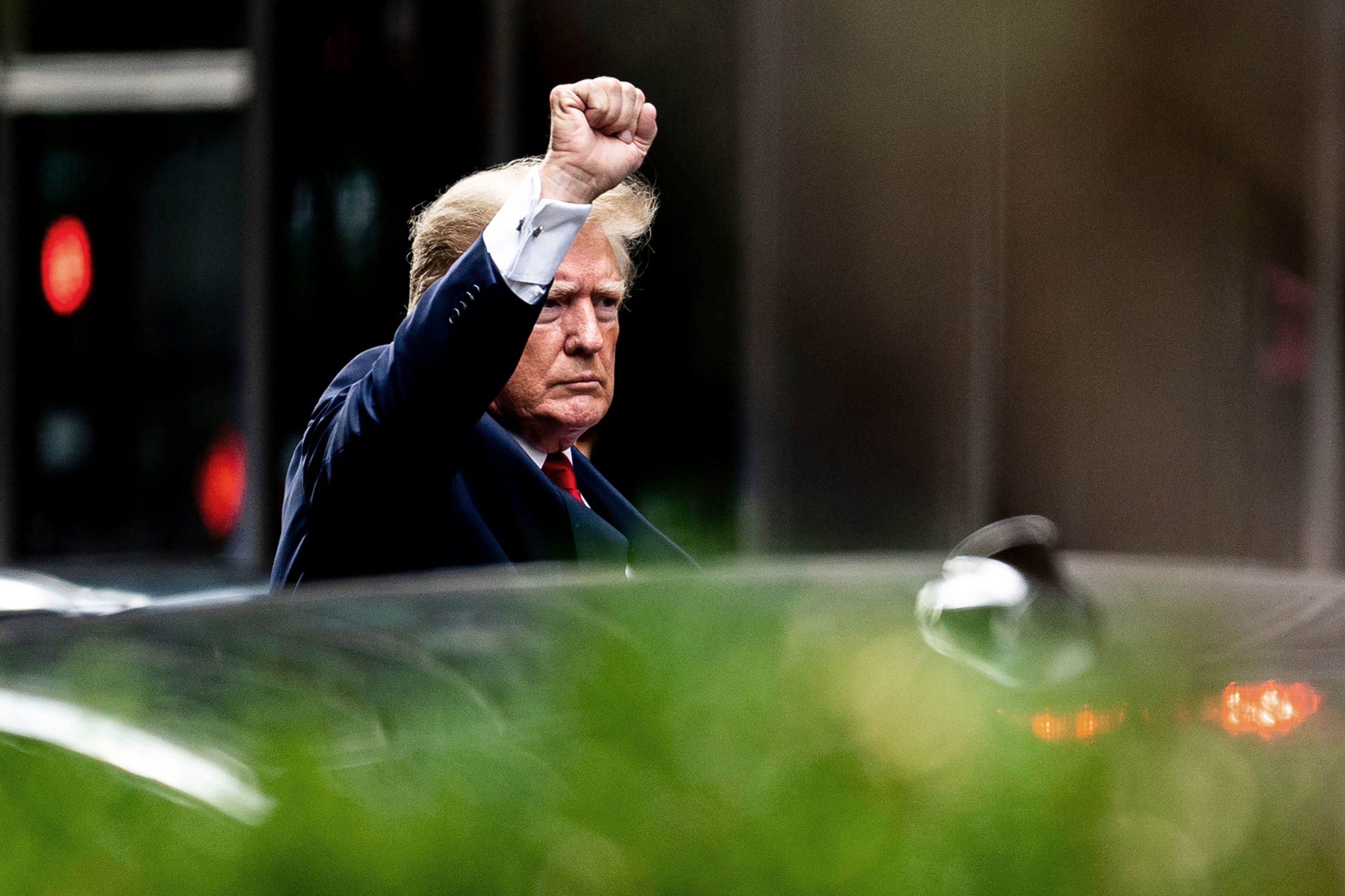 Former US President Donald Trump gestures as he departs Trump Tower in New York on Wednesday, August 10. He was on his way to a scheduled deposition, where he <a href="https://www.cnn.com/2022/08/10/politics/trump-deposition-ny-attorney-general/index.html" target="_blank">invoked his Fifth Amendment rights</a> and declined to answer questions from the New York attorney general.