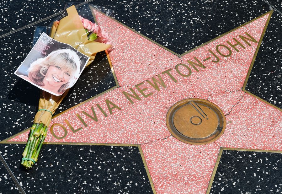Flowers are seen on Olivia Newton-John's star on the Hollywood Walk of Fame on Monday, August 8. <a href="https://www.cnn.com/2022/08/08/entertainment/gallery/olivia-newton-john/index.html" target="_blank">Newton-John,</a> one of the biggest pop stars of the '70s who charmed generations of viewers in the movie musical "Grease," <a href="https://www.cnn.com/2022/08/08/entertainment/olivia-newton-john-obit/index.html" target="_blank">died Monday</a> at the age of 73.