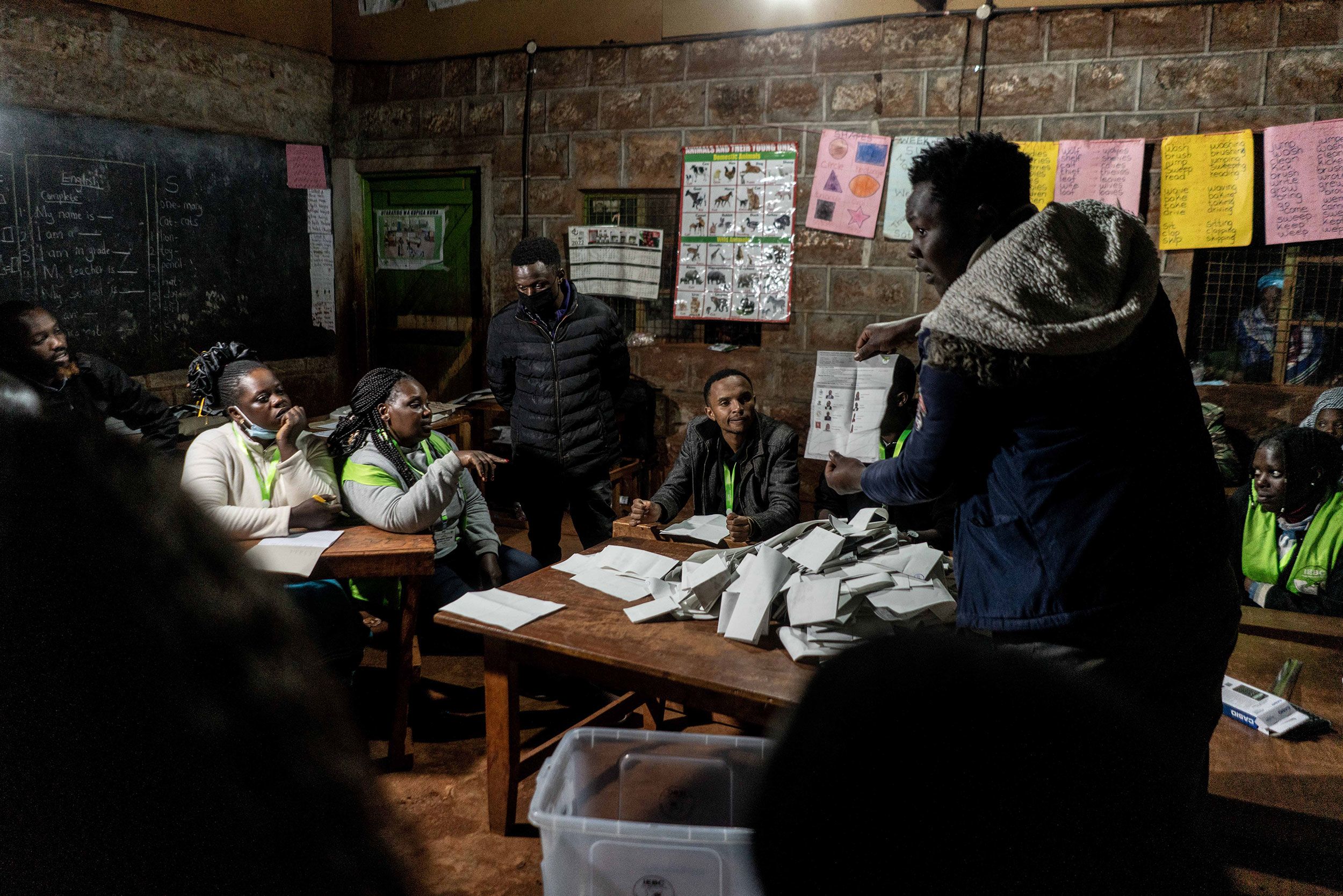 A member of the Independent Electoral and Boundaries Commission shows a presidential ballot in Kenya.