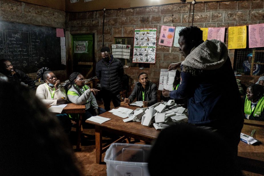 A member of the Independent Electoral and Boundaries Commission shows a presidential ballot to observers in Kenya's Kiambu County on Tuesday, August 9. The country's presidential race <a href="https://www.cnn.com/2022/08/09/africa/kenya-elections-polls-open-intl/index.html" target="_blank">was still too close to call on Thursday.</a>