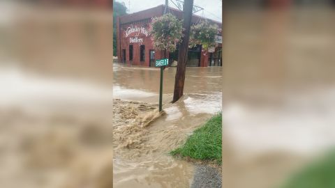 A view of a flooded street in front of the Kentucky Mist Distillery, following a day of heavy rain, in Whitesburg, Kentucky, on July 28, 2022.