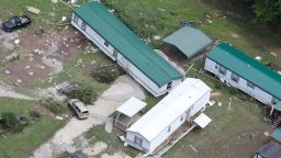 In this aerial photo, mobile homes are seen washed off their foundations on Saturday, July 30, 2022, after historic rains during the week flooded many areas of Kentucky killing multiple people. 