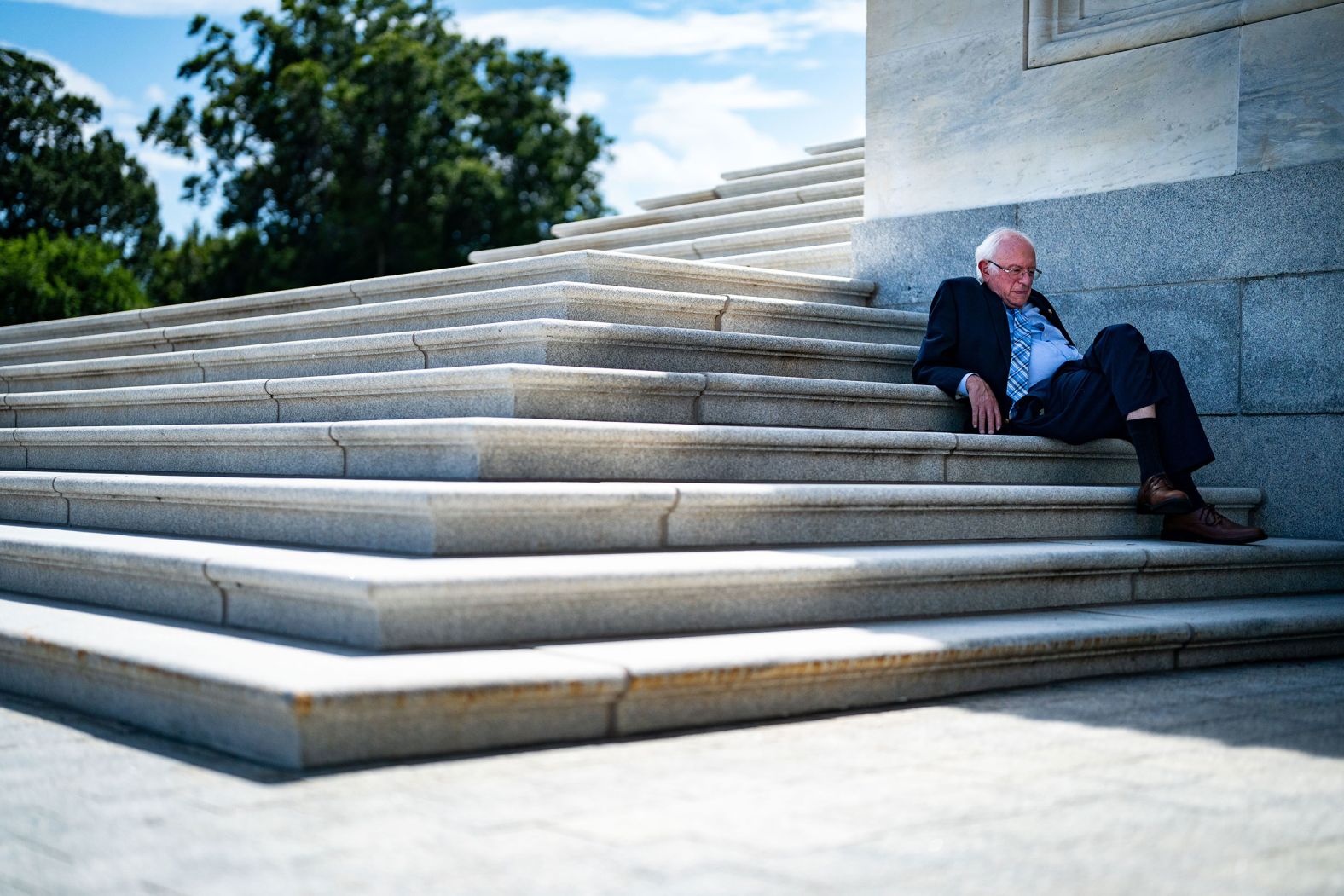 US Sen. Bernie Sanders sits in the shade on the steps of the Senate on Sunday, August 7. That afternoon, <a href="https://www.cnn.com/2022/08/07/politics/senate-democrats-climate-health-care-bill-vote/index.html" target="_blank">the Senate passed Democrats' $750 billion health care, tax and climate bill.</a>