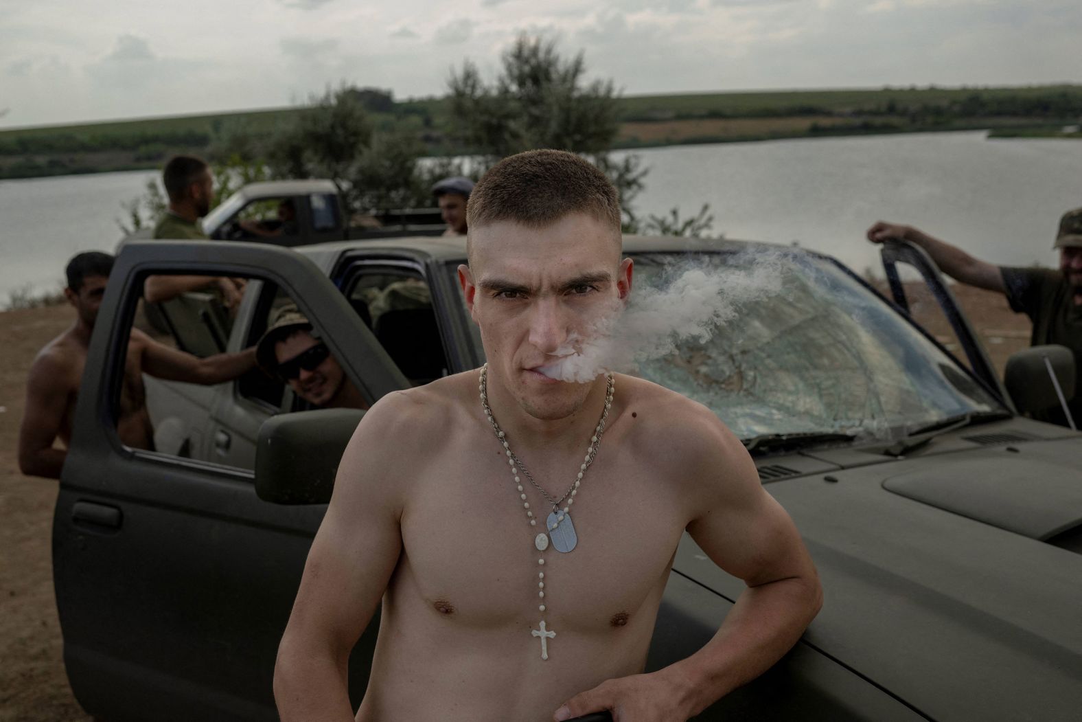 Ukrainian soldiers relax away from the front line in the Donbas region on Wednesday, August 10.
