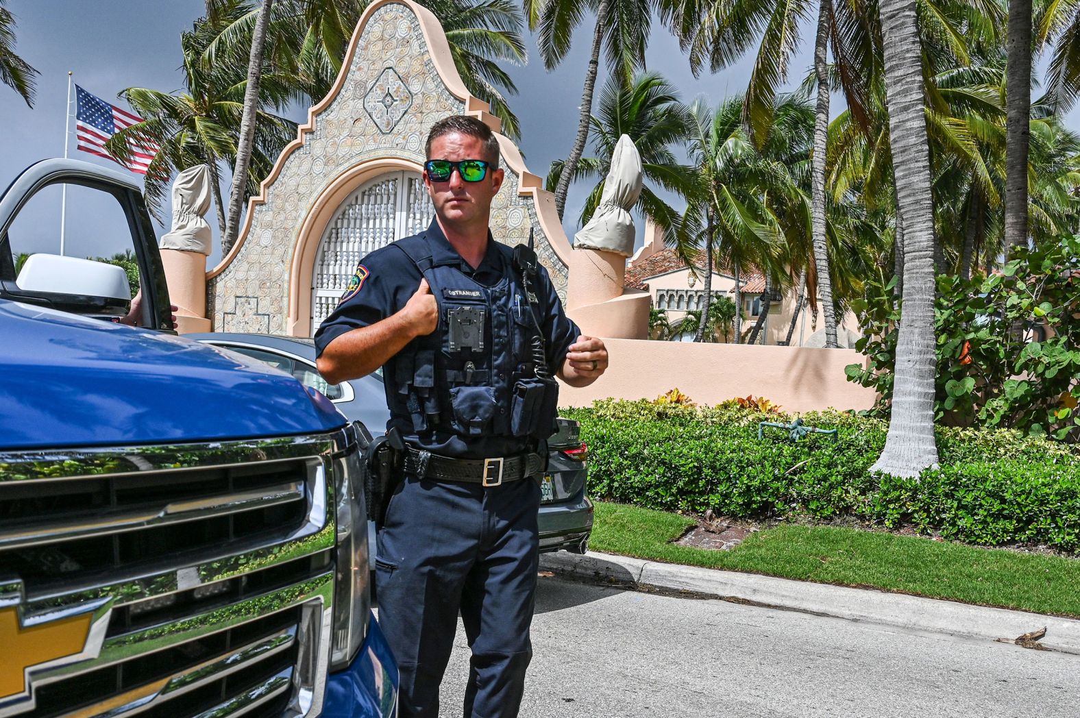 Local law enforcement officers are seen in front of Mar-a-Lago, the home of former US President Donald Trump in Palm Beach, Florida, on Tuesday, August 9. <a href="https://www.cnn.com/2022/08/08/politics/mar-a-lago-search-warrant-fbi-donald-trump/index.html" target="_blank">The FBI executed a search warrant</a> Monday at Trump's resort in connection with an investigation into the handling of classified documents.