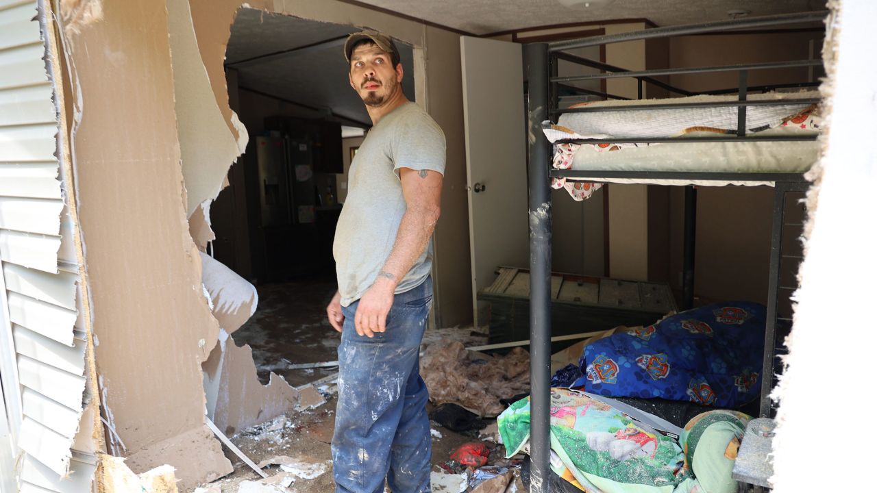 Dustin Elam, 31, stands in his children's former bedroom after his home was destroyed by flooding in Breathitt County, Kentucky.