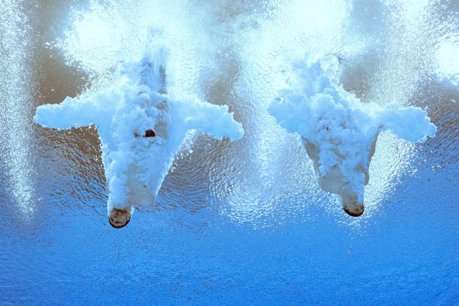 English divers Matthew Lee and Noah Williams splash into the water while competing in the Commonwealth Games on Friday, August 5. They won gold in the synchronized 10-meter platform event.