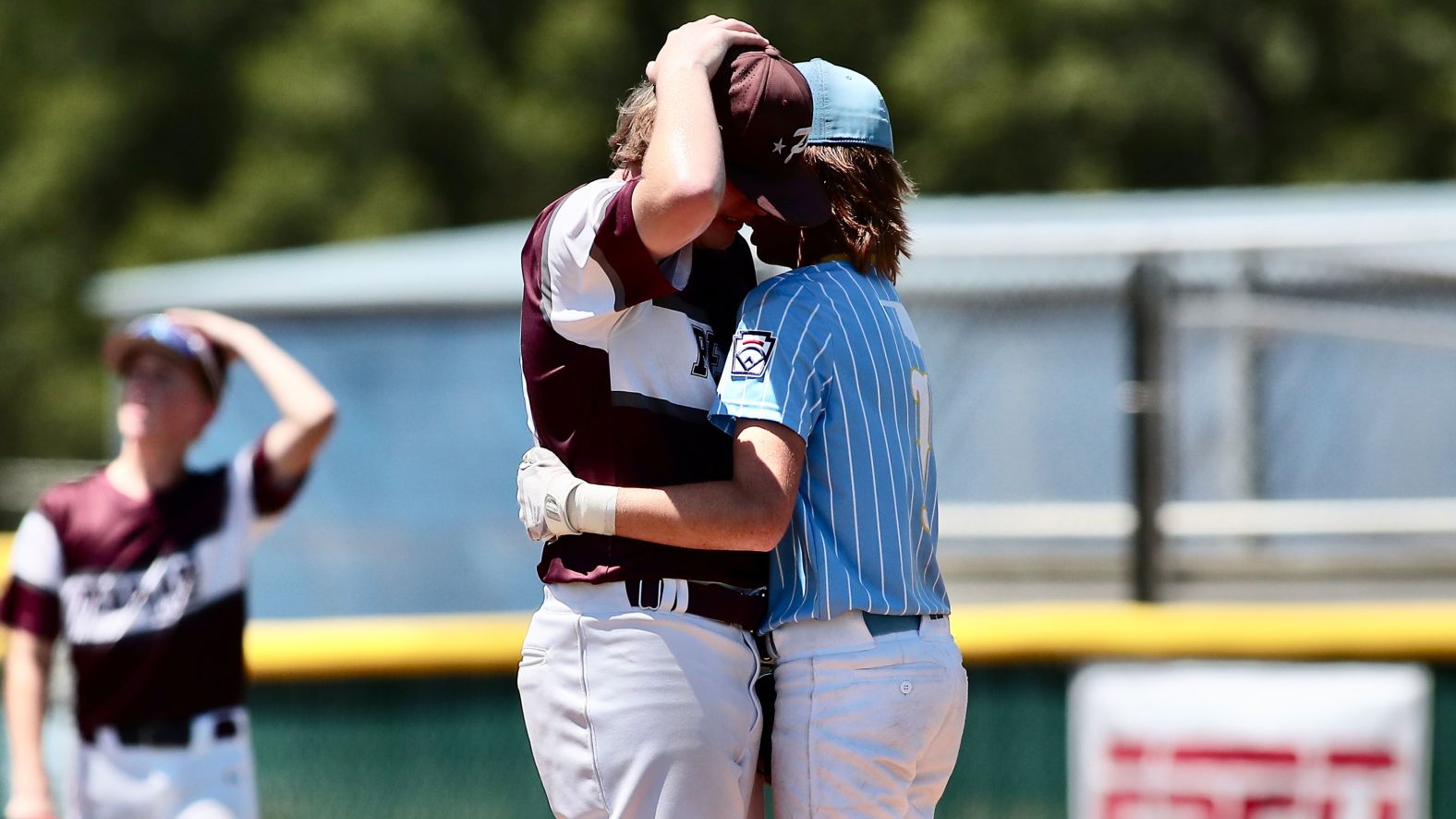 Isaiah Jarvis, right, consoles Kaiden Shelton during a Little League regional championship in Waco, Texas, on Tuesday, August 9. Kaiden had accidentally hit Isaiah in the helmet during an at-bat, and he was upset about the play even though Isaiah was OK. <a href="https://www.cnn.com/2022/08/10/us/little-league-hug-batter-pitcher/index.html" target="_blank">Isaiah walked over to the mound to embrace him</a> and assure him he was fine. "Hey, you're doing great," Isaiah said in a video.