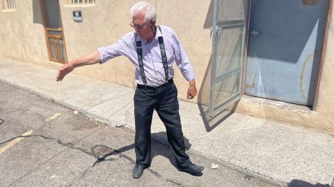 Sharief Hadi shows where his brother, Mohammad Zaher Ahmadi, was shot and killed on November 7, 2021, behind the Halal market they owned together.