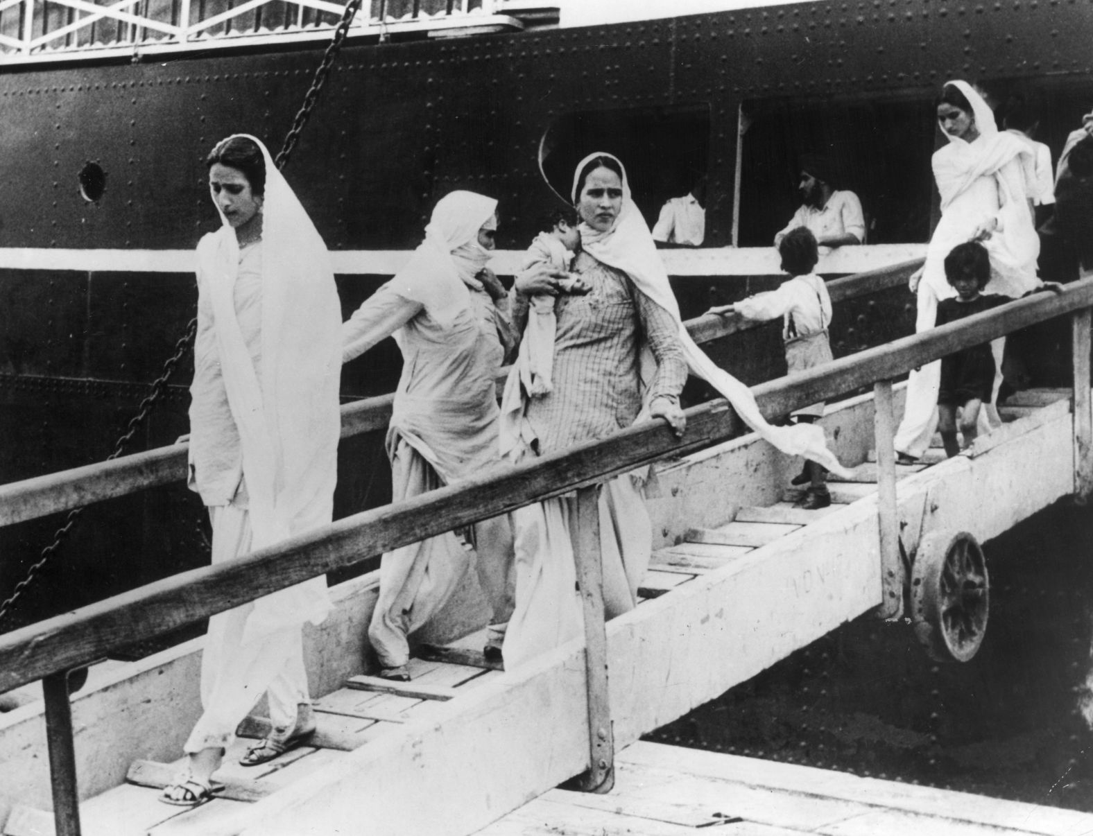 Hindu and Sikh women arrive in Bombay, now Mumbai, with their children on a British-India liner after leaving from Pakistan on October 9, 1947.
