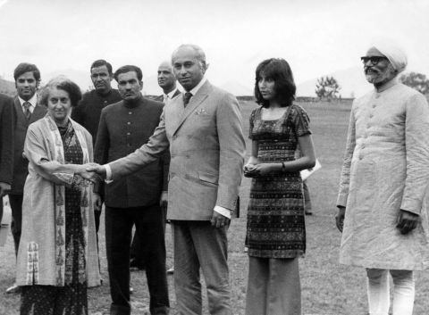 Pakistani President Zulfikar Ali Bhutto with India's Prime Minister Indira Gandhi on June 28, 1972 in Shimla, the former summer capital of British India, while his daughter Benazir Bhutto (second from the right) and Indian Foreign Minister Swaran Singh look on. Bhutto visited India to meet Gandhi and negotiated a formal peace agreement and the release of 93,000 Pakistani prisoners of war. The two leaders signed the Shimla Agreement, which committed both nations to establish a Line of Control in Kashmir.