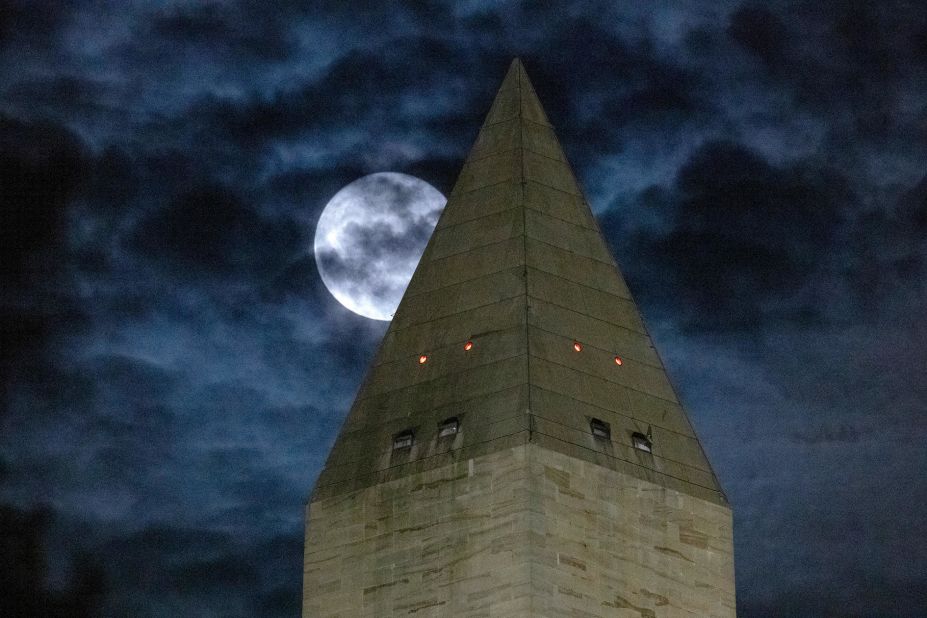 The full moon is shown behind the Washington Monument on August 11 in Washington, DC. The sturgeon moon is the fourth and final supermoon of 2022.
