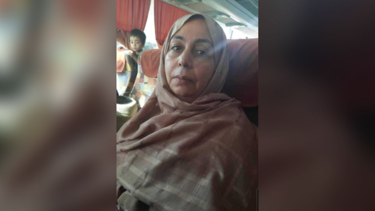 Judge Fawzia Amini is pictured on an overnight bus journey to Mazar-i-Sharif, from where she flew out of the country.