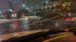 A video shared by Twitter user @808Grinder shows serious street flooding in Enterprise, in the Las Vegas Valley. Cars can be seen driving through the high water, and one car is dragging a bumper that has partially fallen off.