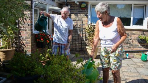 David and Margaret Miller water their plants at their home in Edenbridge.