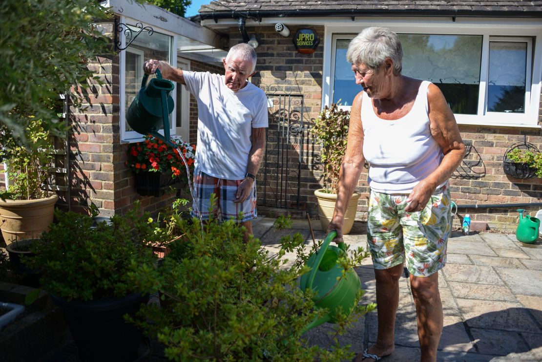 David and Margaret Miller water their plants at their home in Edenbridge.